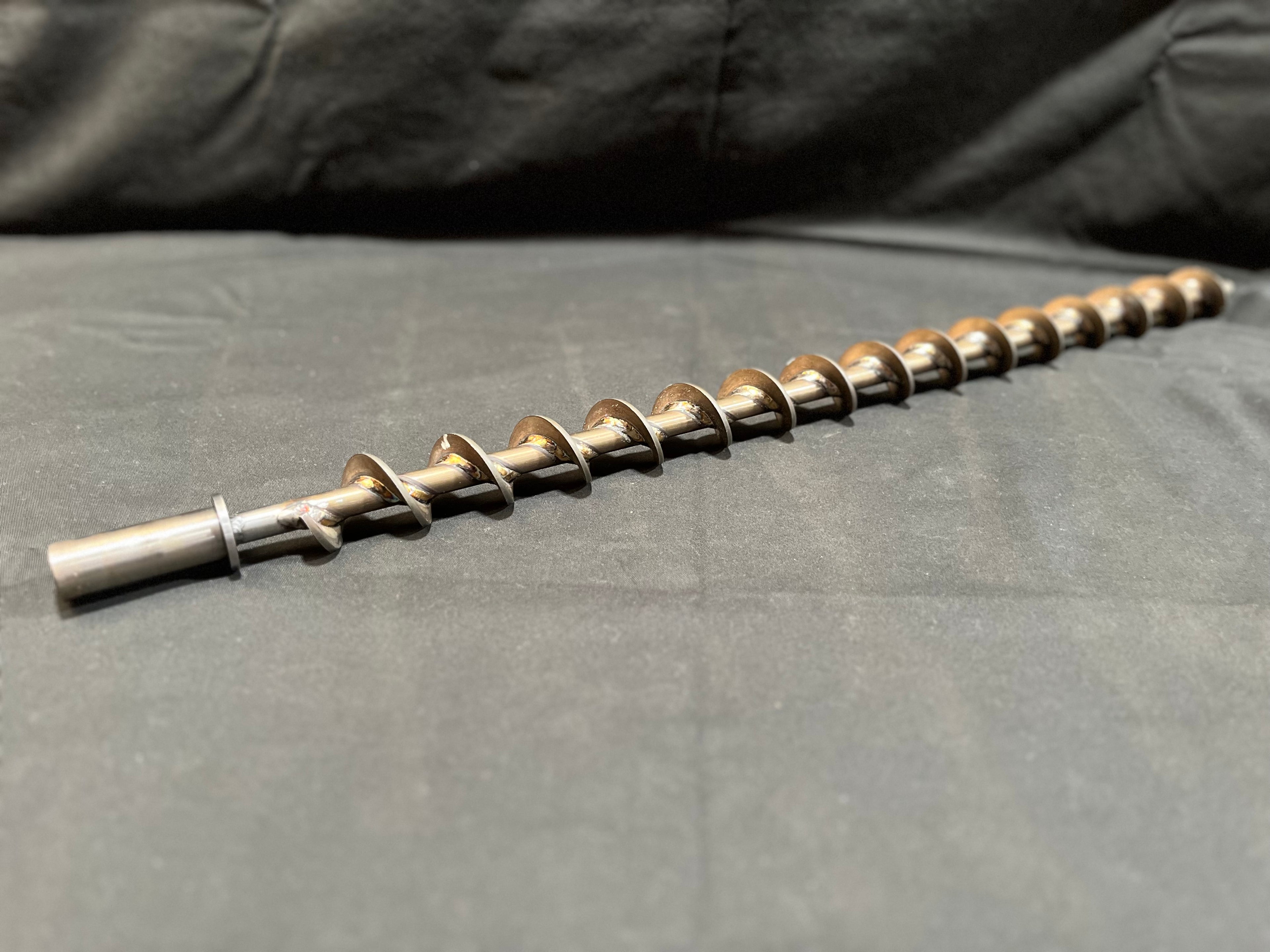 Metal Auger on gray background