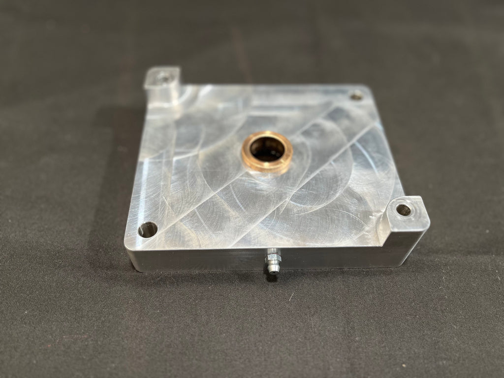 Metal mounting block on gray surface