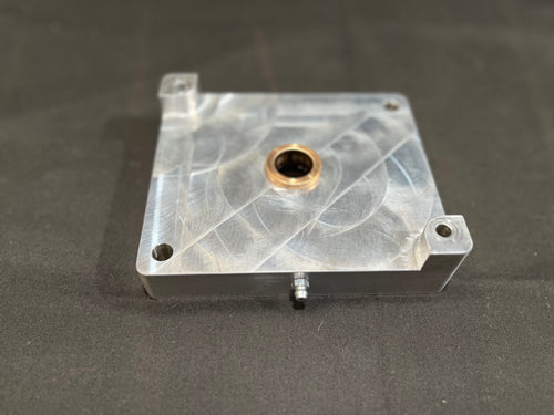 Metal mounting block on gray surface