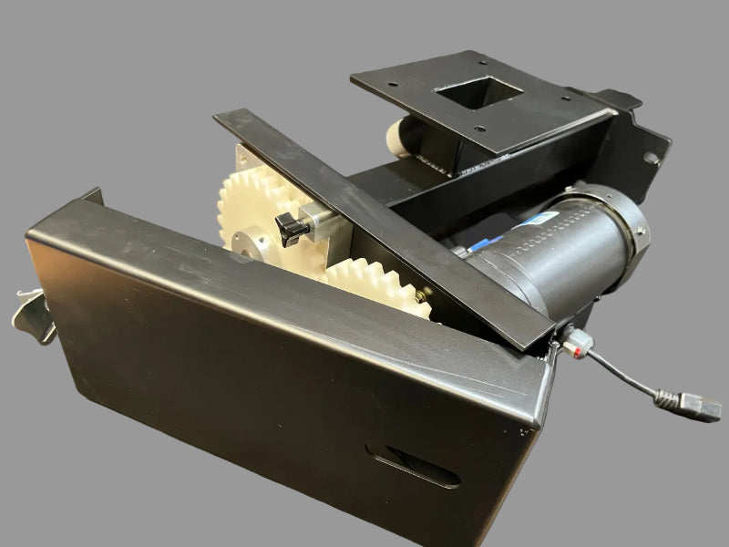 AccuFeeder Unit - A Mechanical device with gears and metal components on a gray surface
