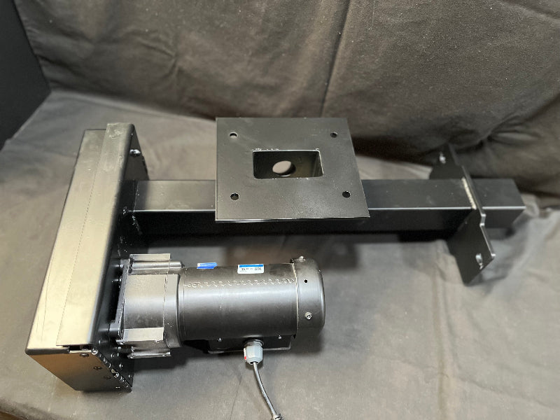 AccuFeeder Unit - A Mechanical device with a motor on a gray surface