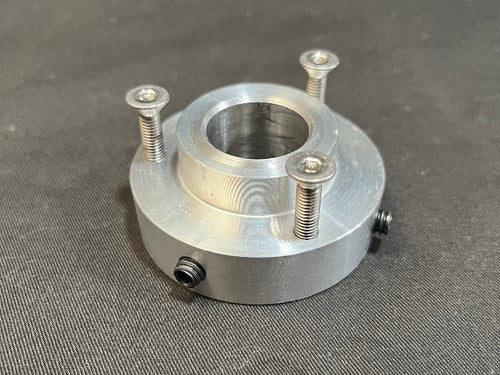 Metal component with threaded holes on a gray background