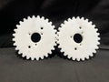 Two white gears on a black background