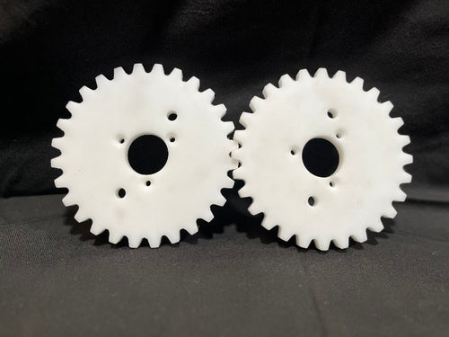 Two white gears on a black background