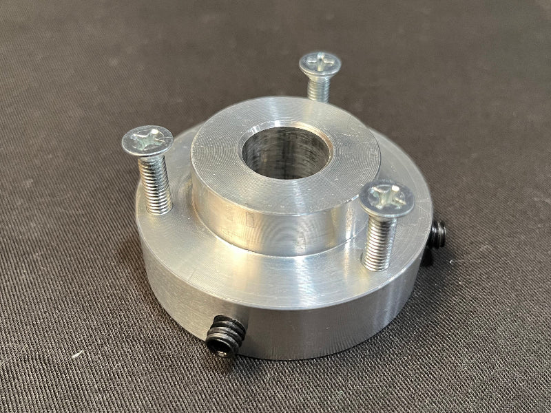 Metal component with threaded holes on a gray background